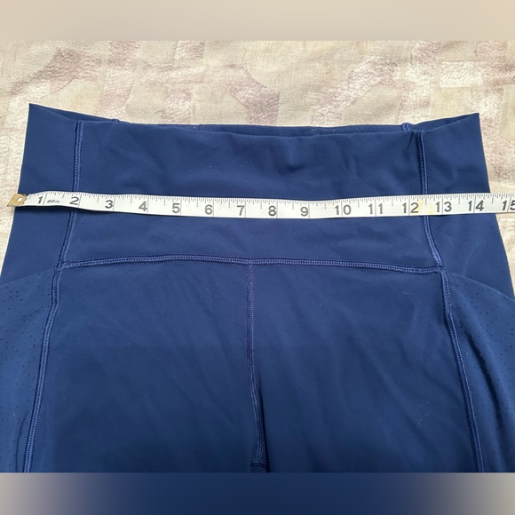 Lululemon navy leggings w/ laser cut design down sides - Picture 10 of 10